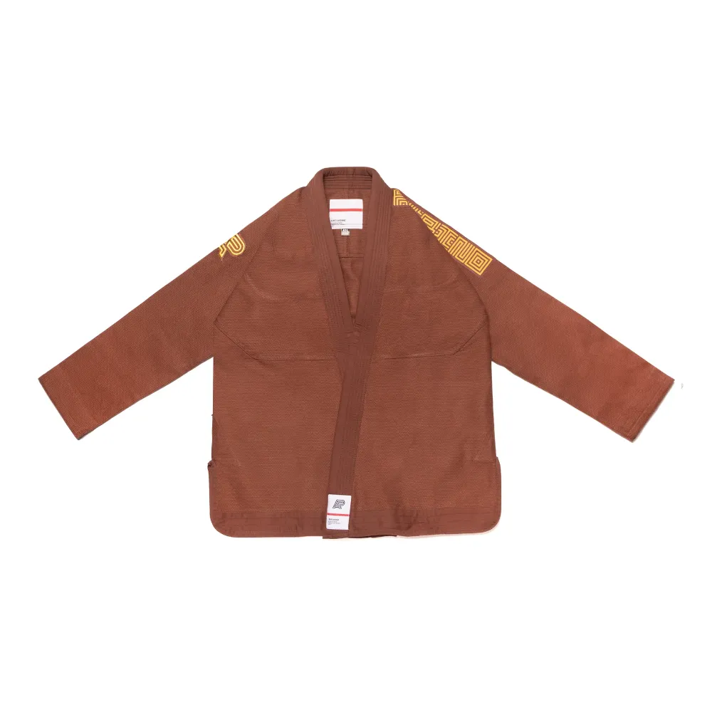 Umber Bjj Gi: The Albino & Preto Batch #56 Collector Tier Kimono. Umber Bjj Gi limited edition Albino and Preto Batch 56 featuring high-density earth-toned accent embroidery.