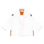 White Albino and Preto Batch 59 Bjj Gi RS350 showing high-density orange logo embroidery on a premium weave.