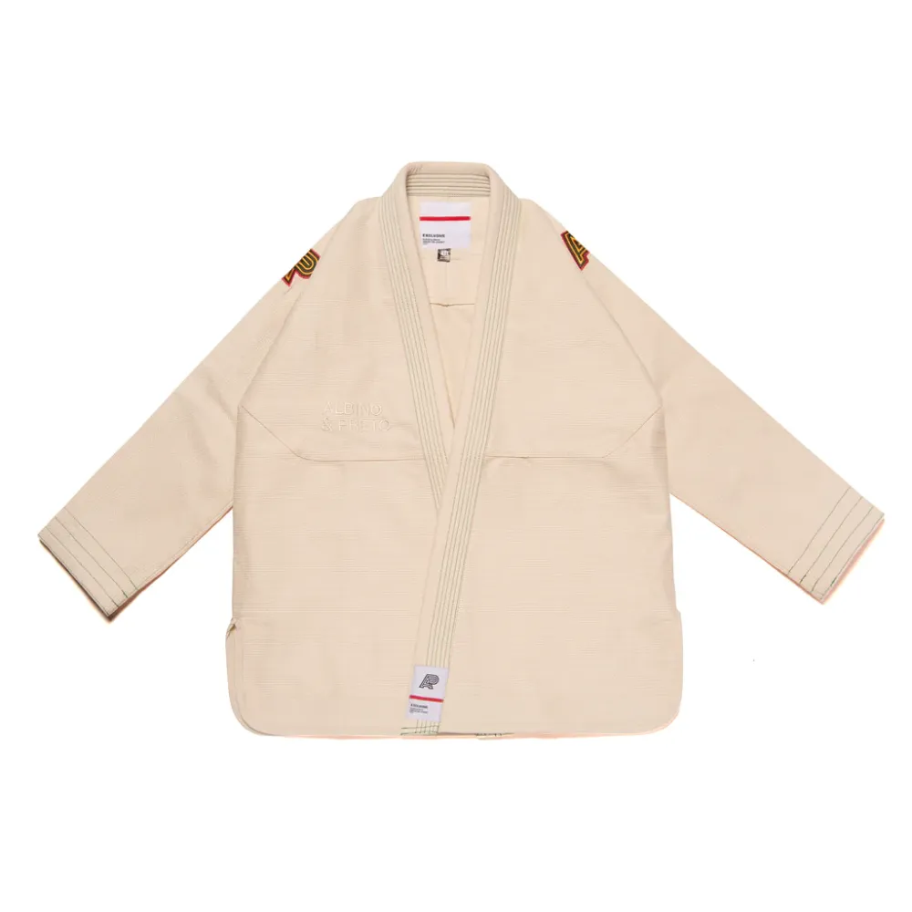 Tri-Color Bjj Gi: The Albino & Preto Batch #65 OGB Unbleached Collector Tier Kimono. Tri-Color Bjj Gi unbleached edition of Albino and Preto Batch 65 OGB showcasing natural cream cotton weave and triple-tone accent stitching.